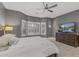 Spacious main bedroom featuring an abundance of natural light and tiled floors at 16232 W Montoya Dr, Surprise, AZ 85374