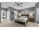 Spacious main bedroom featuring neutral paint, wood accents, and doors to other rooms at 16232 W Montoya Dr, Surprise, AZ 85374