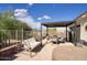 Backyard patio with shaded seating, a swing, and a hot tub under the bright, sunny sky at 16836 E Mirage Crossing Ct # B, Fountain Hills, AZ 85268