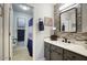 Stylish bathroom with a modern vanity, decorative mirror, and coordinated fixtures at 16836 E Mirage Crossing Ct # B, Fountain Hills, AZ 85268