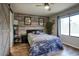 Cozy bedroom with wood-look flooring and a decorative barn door at 16836 E Mirage Crossing Ct # B, Fountain Hills, AZ 85268