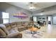 Spacious living room with a sectional sofa and open access to the dining area at 16836 E Mirage Crossing Ct # B, Fountain Hills, AZ 85268