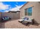 Backyard with a brick patio, block wall, and comfortable seating at 17431 W Via De Luna Dr, Surprise, AZ 85387