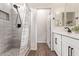 Bathroom boasting a shower and a modern vanity with sleek black hardware at 17431 W Via De Luna Dr, Surprise, AZ 85387