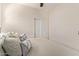 Comfortable bedroom featuring plush pillows and a sliding door closet for ample storage at 17431 W Via De Luna Dr, Surprise, AZ 85387