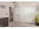 Bedroom featuring carpet, an open door, and closet with sliding doors at 17431 W Via De Luna Dr, Surprise, AZ 85387