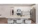 A bright and modern kitchen featuring stainless steel appliances, granite countertops and white cabinetry at 17431 W Via De Luna Dr, Surprise, AZ 85387