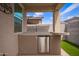 Backyard featuring an outdoor kitchen with granite countertops and artificial grass at 17431 W Via De Luna Dr, Surprise, AZ 85387