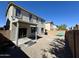 Spacious backyard with gravel, covered patio, and low-maintenance landscaping at 17477 W Woodrow Ln, Surprise, AZ 85388