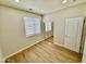 Bedroom featuring wood laminate floors, recessed lighting, and sliding mirrored closet doors at 17477 W Woodrow Ln, Surprise, AZ 85388