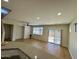 The living room offers an open floor plan, recessed lighting, and a sliding glass door at 17477 W Woodrow Ln, Surprise, AZ 85388
