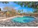 Sparkling pool is surrounded by mature trees and desert landscape at 1811 E Aurelius Ave, Phoenix, AZ 85020