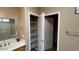 Bathroom closet with wire shelving for organization and storage solutions at 19058 N Aztec Point Dr, Surprise, AZ 85387