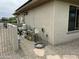 Exterior home view showing equipment, windows, and gravel ground at 19058 N Aztec Point Dr, Surprise, AZ 85387
