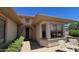 Inviting home entrance with stone accents and a charming arched doorway on a sunny day at 19058 N Aztec Point Dr, Surprise, AZ 85387