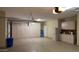 Well-organized garage with storage cabinets and epoxy flooring, providing a functional space at 19058 N Aztec Point Dr, Surprise, AZ 85387