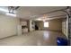 Spacious garage with epoxy flooring, storage cabinets, and ample room for vehicles and projects at 19058 N Aztec Point Dr, Surprise, AZ 85387
