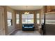 Bright living area with a sofa, large windows and a decorative rug at 19058 N Aztec Point Dr, Surprise, AZ 85387