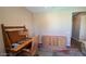 Comfortable office space featuring hardwood desk and matching credenza on multi-colored carpet at 19058 N Aztec Point Dr, Surprise, AZ 85387