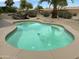 Backyard view of the refreshing pool and an above ground hot tub, perfect for relaxing at 19058 N Aztec Point Dr, Surprise, AZ 85387