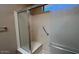Modern shower features glass doors, a built-in seat, and safety grab bars at 19058 N Aztec Point Dr, Surprise, AZ 85387