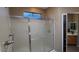Spacious walk-in shower with glass doors and updated shower fixtures at 19058 N Aztec Point Dr, Surprise, AZ 85387