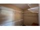 Large walk-in closet with a corner layout and wire shelving for storage at 19058 N Aztec Point Dr, Surprise, AZ 85387