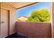 Balcony with a glimpse of a lush green tree and roof tiles at 1942 S Emerson -- # 219, Mesa, AZ 85210
