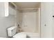 Bathroom with a toilet, shower/tub combo, and storage above toilet at 1942 S Emerson -- # 219, Mesa, AZ 85210