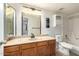 Bathroom featuring a vanity with a marble top, toilet, and a shower/tub combo at 1942 S Emerson -- # 219, Mesa, AZ 85210