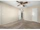 Neutral bedroom with beige carpet, ceiling fan, and white doors at 1942 S Emerson -- # 219, Mesa, AZ 85210