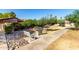 Common area features a bench, barbecue, landscaping, and paved walkway at 1942 S Emerson -- # 219, Mesa, AZ 85210