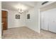 Open dining room with tile flooring, chandelier lighting, and easy access to the kitchen at 1942 S Emerson -- # 219, Mesa, AZ 85210