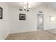 Bright dining room with tile flooring and a modern chandelier fixture at 1942 S Emerson -- # 219, Mesa, AZ 85210