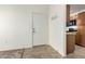 The entryway of a condo features a coat rack and kitchen view, providing a convenient and welcoming transition at 1942 S Emerson -- # 219, Mesa, AZ 85210
