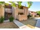 A well-maintained two-story condo complex with stucco walls, private balconies, and landscaped grounds at 1942 S Emerson -- # 219, Mesa, AZ 85210