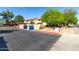 Exterior view of building with mature trees and a parking area at 1942 S Emerson -- # 219, Mesa, AZ 85210