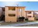 A two-story condo showcasing private balconies, palm trees, and easy access to walkways and shared outdoor areas at 1942 S Emerson -- # 219, Mesa, AZ 85210