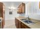 Kitchen featuring wood-style cabinets and a stainless steel sink at 1942 S Emerson -- # 219, Mesa, AZ 85210