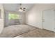 A bright condo living room featuring a fan, sliding glass doors and an open floor plan at 1942 S Emerson -- # 219, Mesa, AZ 85210