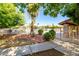 A fenced community pool surrounded by manicured trees and bushes at 1942 S Emerson -- # 219, Mesa, AZ 85210