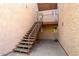 A condo with a staircase leading to upper units, showcasing a practical and accessible design at 1942 S Emerson -- # 219, Mesa, AZ 85210