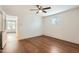 Bedroom featuring new floors, a ceiling fan, and an adjacent room perfect for an office at 2021 W Clarendon Ave, Phoenix, AZ 85015