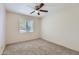 Bedroom featuring carpet, a ceiling fan, and a window at 2021 W Clarendon Ave, Phoenix, AZ 85015