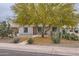 Charming home featuring desert landscaping, including mature trees and native cacti at 2021 W Clarendon Ave, Phoenix, AZ 85015