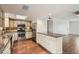 Traditional eat-in kitchen featuring stainless steel appliances, granite counters and custom cabinets at 2021 W Clarendon Ave, Phoenix, AZ 85015