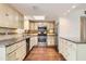 Traditional eat-in kitchen featuring stainless steel appliances, granite counters and custom cabinets at 2021 W Clarendon Ave, Phoenix, AZ 85015