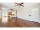 Bright living room featuring hardwood floors that opens into a modern kitchen at 2021 W Clarendon Ave, Phoenix, AZ 85015