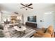 Living room featuring hardwood floors that opens into a modern kitchen at 2021 W Clarendon Ave, Phoenix, AZ 85015