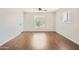 Bright living room featuring hardwood floors and large windows at 2021 W Clarendon Ave, Phoenix, AZ 85015